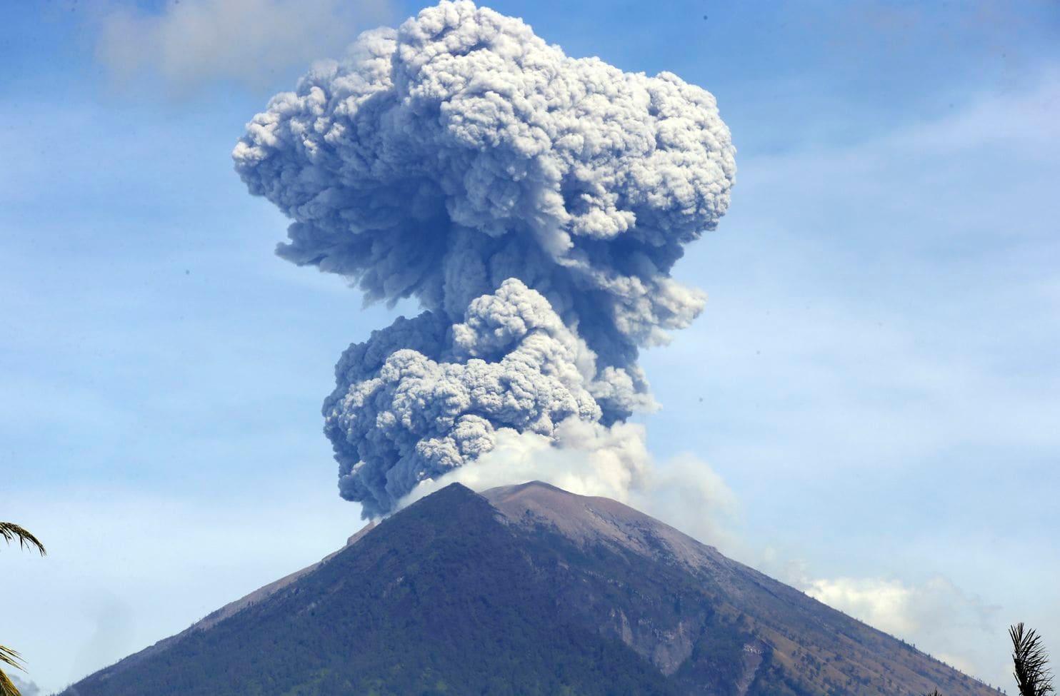 Bali volcano hurls lava and ash, airport unaffected