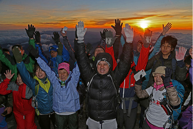 Visitors enjoy Mt. Fuji sunrise as climbing season opens