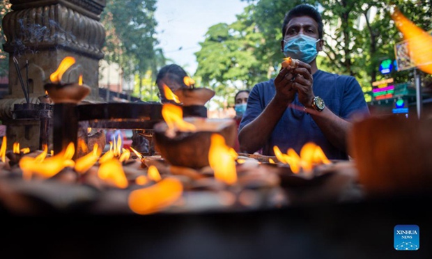 Malaysia lifts travel bans, cuts booster wait times amid pandemic