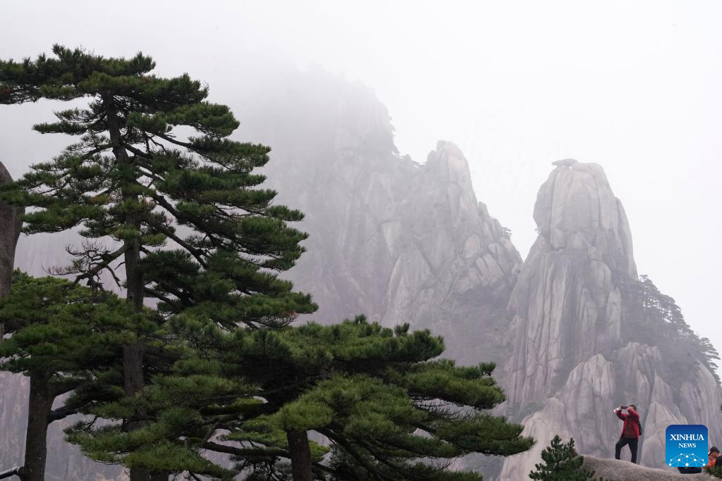 Tourists visit Huangshan Mountain in E China