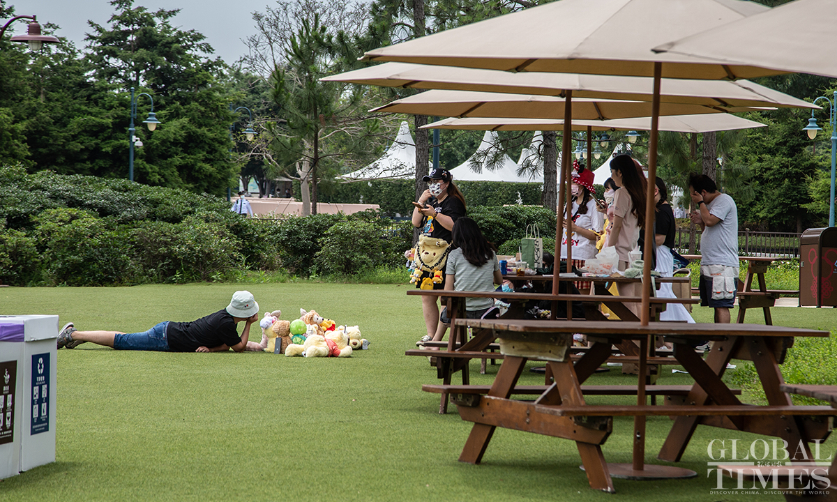 People enjoy themselves at the Wishing Star Park at Shanghai Disney Resort on June 16. Photo: Wu Shiliu